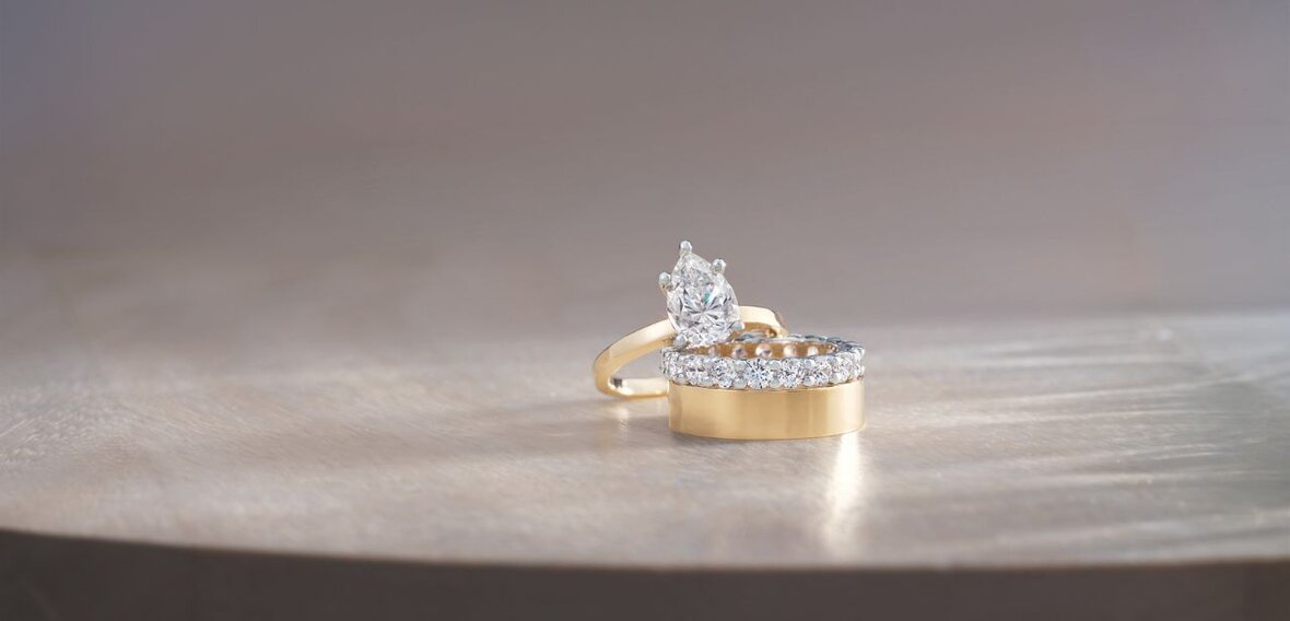 Elegant gold engagement ring with diamond with matching wedding bands by Wedding Bands & Co., Chicago custom jeweler