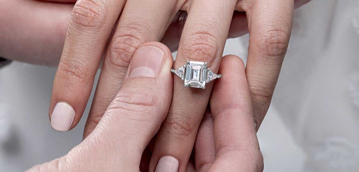 Wedding rings with eternity-style gemstone bands that are difficult or impossible to resize
