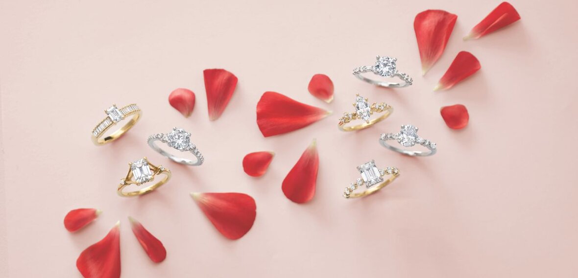 White and yellow gold diamond wedding bands styled on lace fabric, showcasing elegant bridal ring designs by Wedding Bands & Co. in Chicago