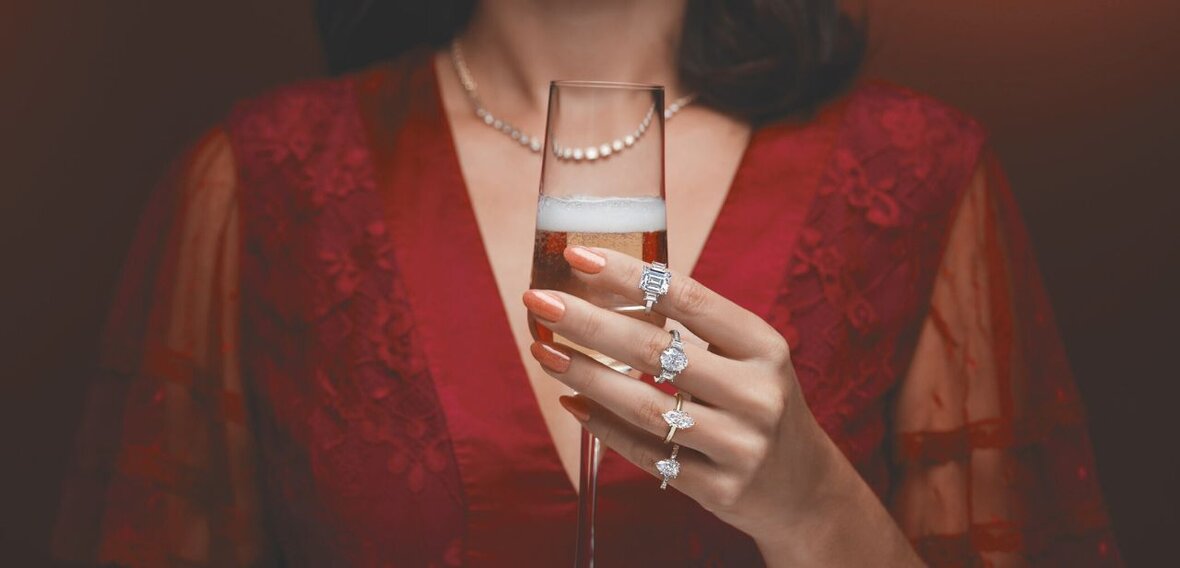 White and yellow gold diamond wedding bands styled on lace fabric, showcasing elegant bridal ring designs by Wedding Bands & Co. in Chicago