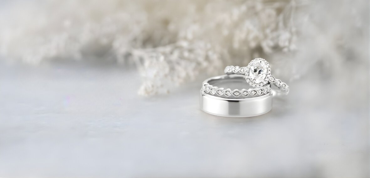 Yellow gold engagement ring and wedding band set showing traditional stacking order and fit