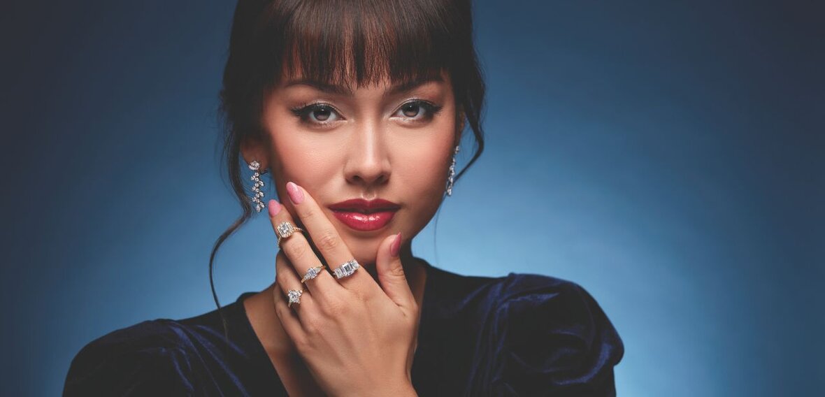 White and yellow gold diamond wedding bands styled on lace fabric, showcasing elegant bridal ring designs by Wedding Bands & Co. in Chicago