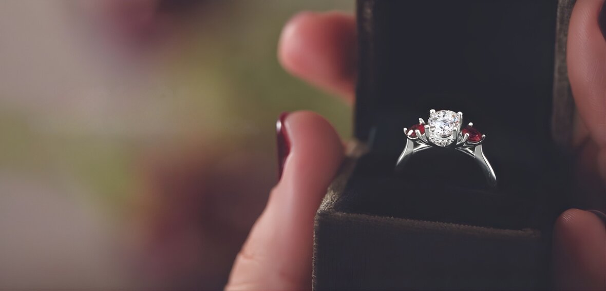 Gold engagement ring with pavé diamond band and plain wedding bands for all partners and genders