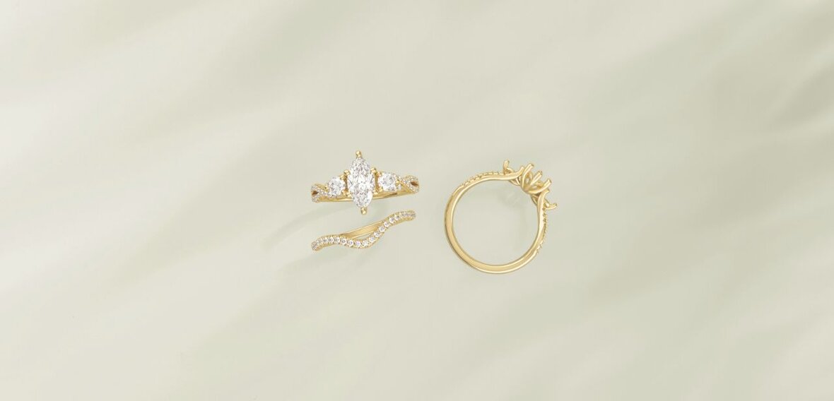 White and yellow gold diamond wedding bands styled on lace fabric, showcasing elegant bridal ring designs by Wedding Bands & Co. in Chicago