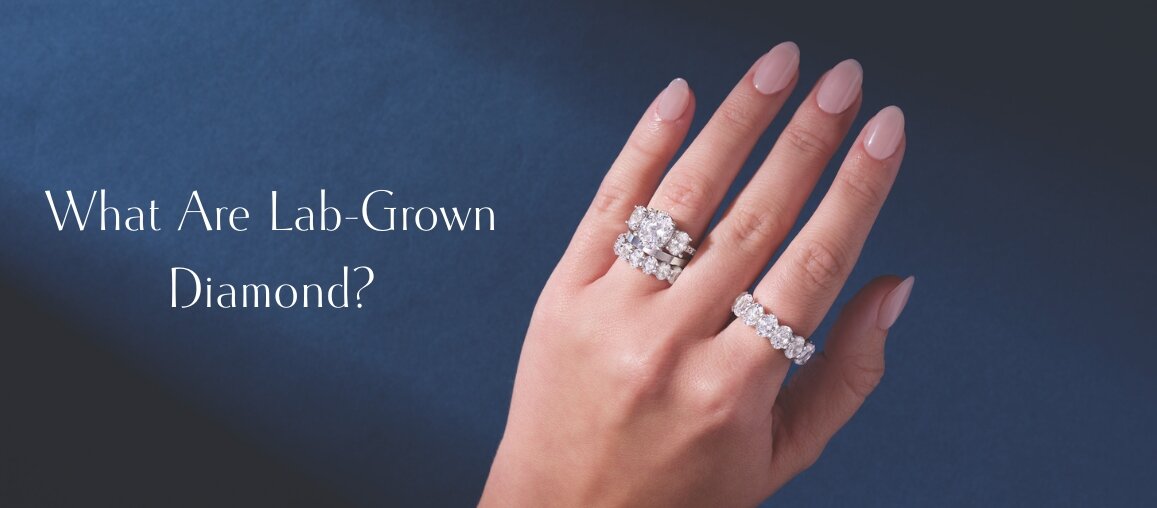 Hand wearing lab-grown diamond engagement ring and diamond wedding band showcasing brilliance and modern diamond design