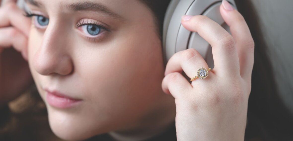 White and yellow gold diamond wedding bands styled on lace fabric, showcasing elegant bridal ring designs by Wedding Bands & Co. in Chicago