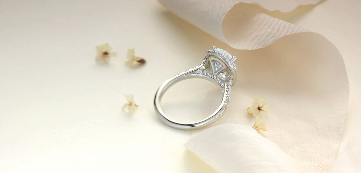 White and yellow gold diamond wedding bands styled on lace fabric, showcasing elegant bridal ring designs by Wedding Bands & Co. in Chicago