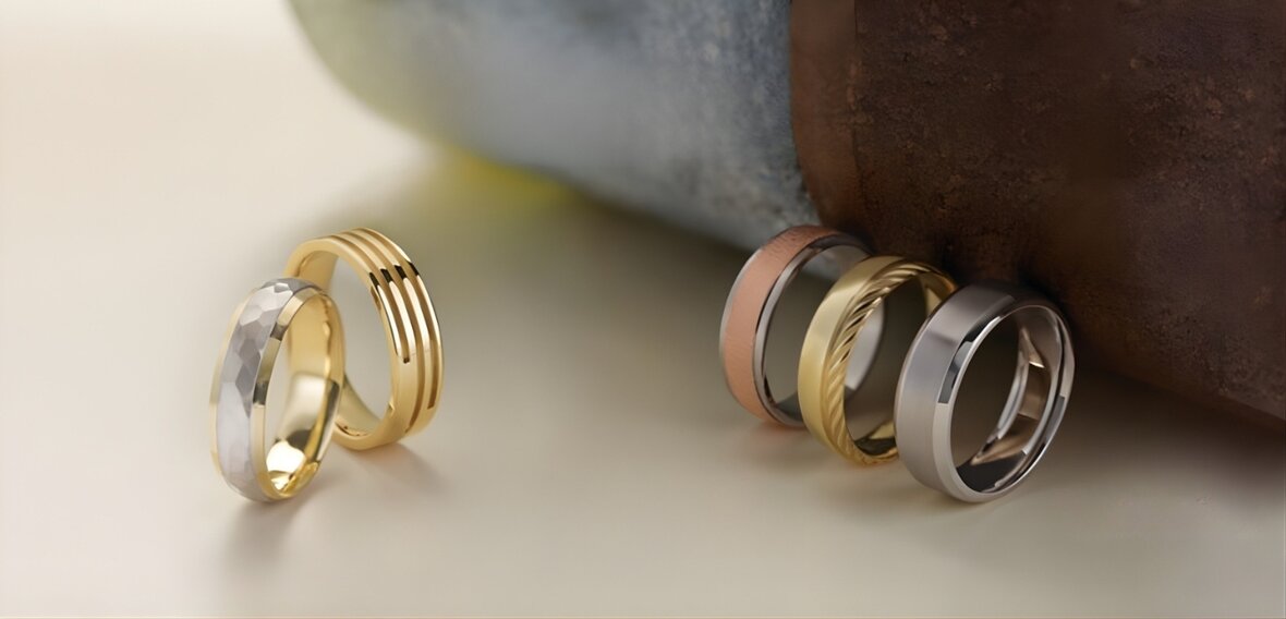 White and yellow gold diamond wedding bands on vintage lace fabric showing historical ring craftsmanship