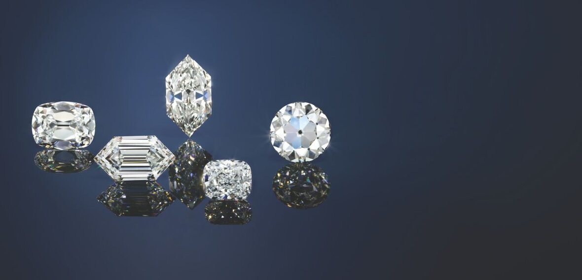 White and yellow gold diamond wedding bands styled on lace fabric, showcasing elegant bridal ring designs by Wedding Bands & Co. in Chicago