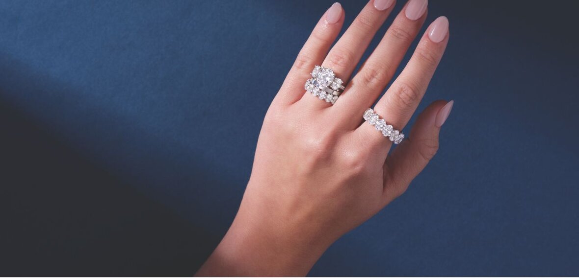 Elegant gold engagement ring with diamond pavé band stacked with matching wedding bands by Wedding Bands & Co., Chicago custom jeweler