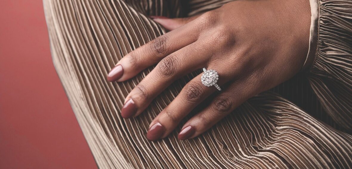 White and yellow gold diamond wedding bands styled on lace fabric, showcasing elegant bridal ring designs by Wedding Bands & Co. in Chicago