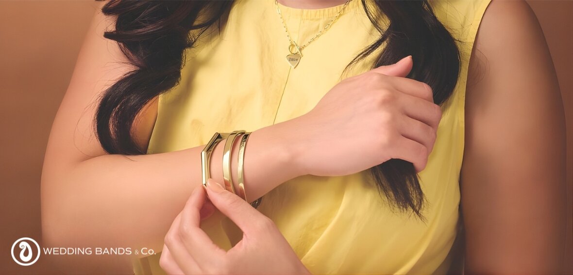 Diamond tennis bracelet layered with gold chains demonstrating 2025 bracelet stacking trends