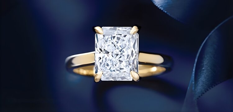 Emerald cut engagement ring in solitaire setting with platinum band showing Art Deco style