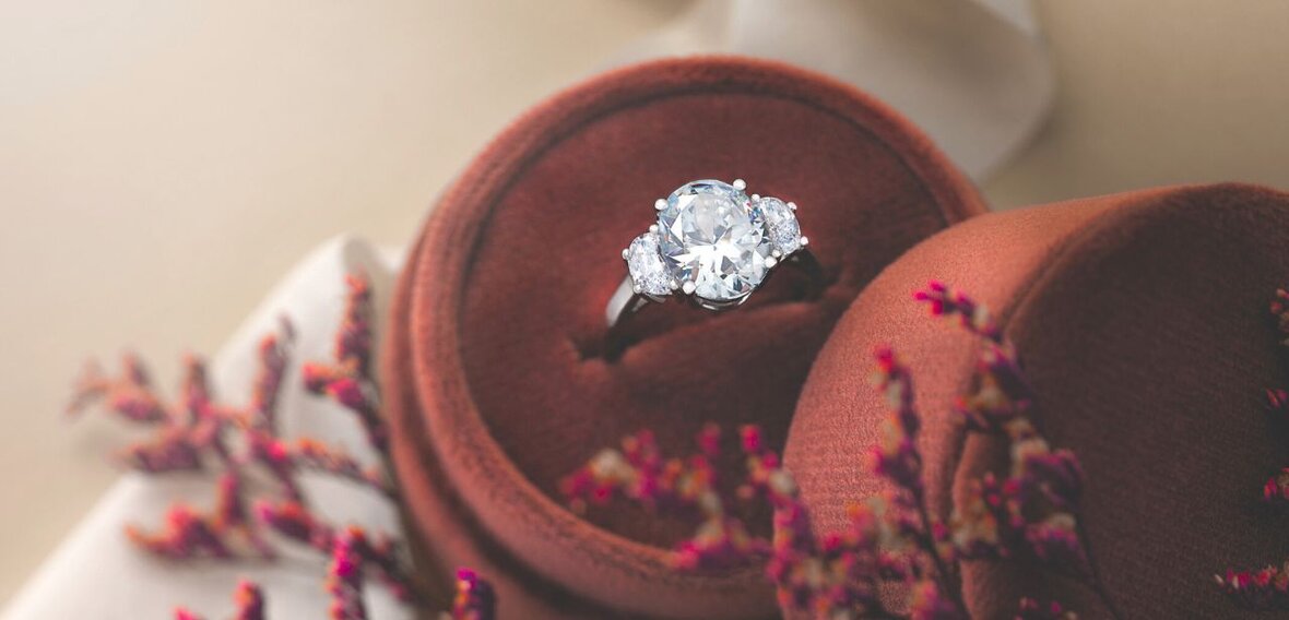 White and yellow gold diamond wedding bands styled on lace fabric, showcasing elegant bridal ring designs by Wedding Bands & Co. in Chicago