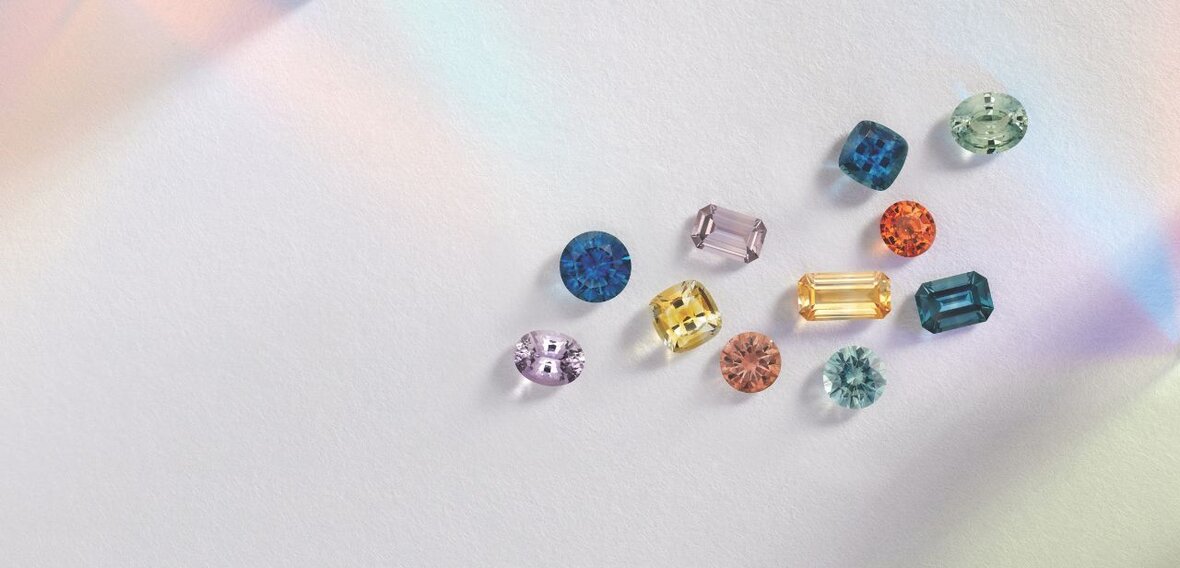 White and yellow gold diamond wedding bands styled on lace fabric, showcasing elegant bridal ring designs by Wedding Bands & Co. in Chicago