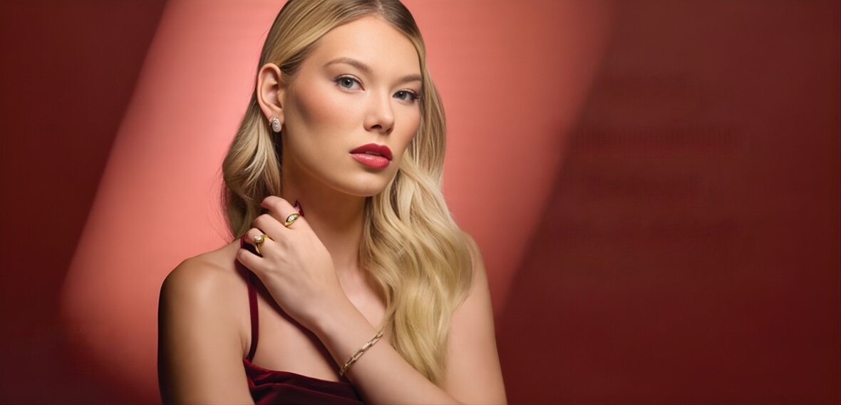 Gold engagement ring with pavé diamond band paired with matching wedding bands showing coordinated bridal set