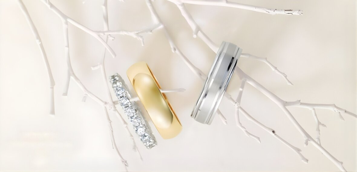 White and yellow gold diamond wedding bands on lace showing traditional and custom design options