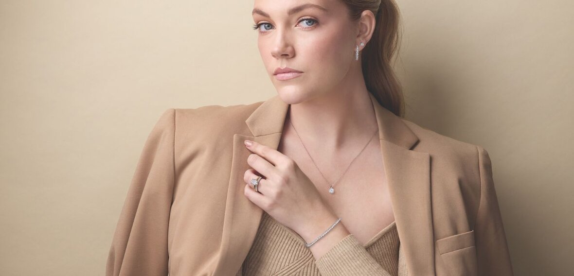 White and yellow gold diamond wedding bands styled on lace fabric, showcasing elegant bridal ring designs by Wedding Bands & Co. in Chicago