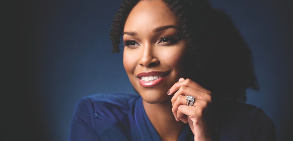 White and yellow gold diamond wedding bands styled on lace fabric, showcasing elegant bridal ring designs by Wedding Bands & Co. in Chicago