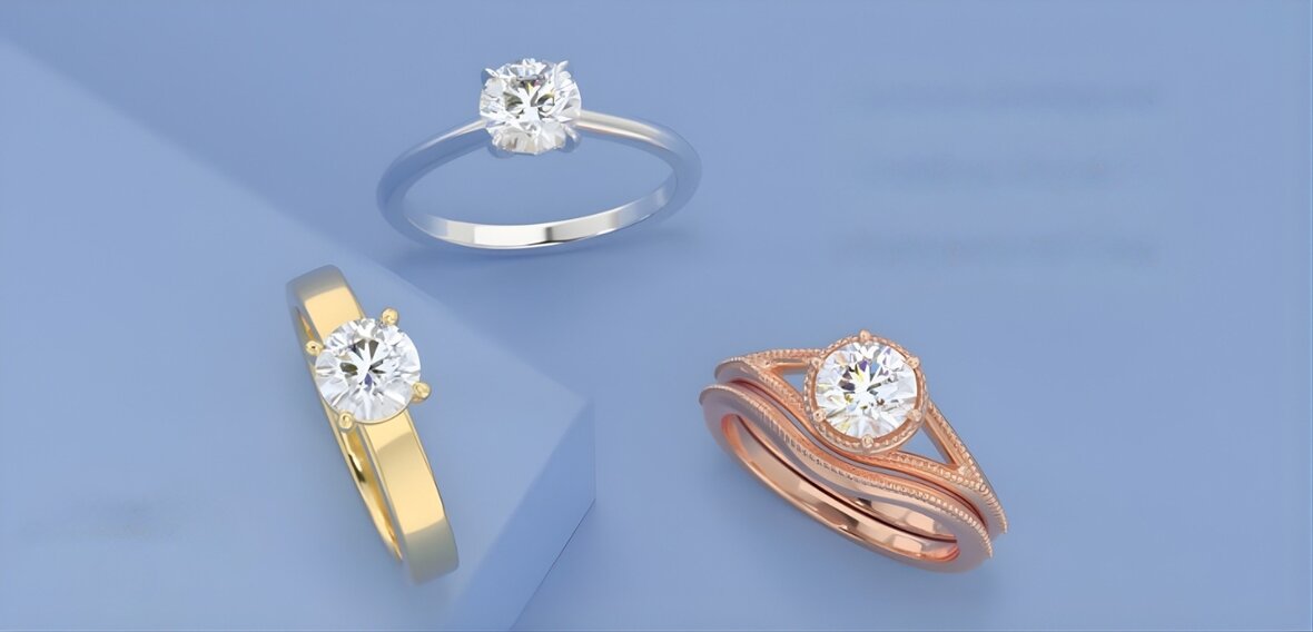 White and yellow gold diamond wedding bands on lace fabric designed to complement solitaire settings