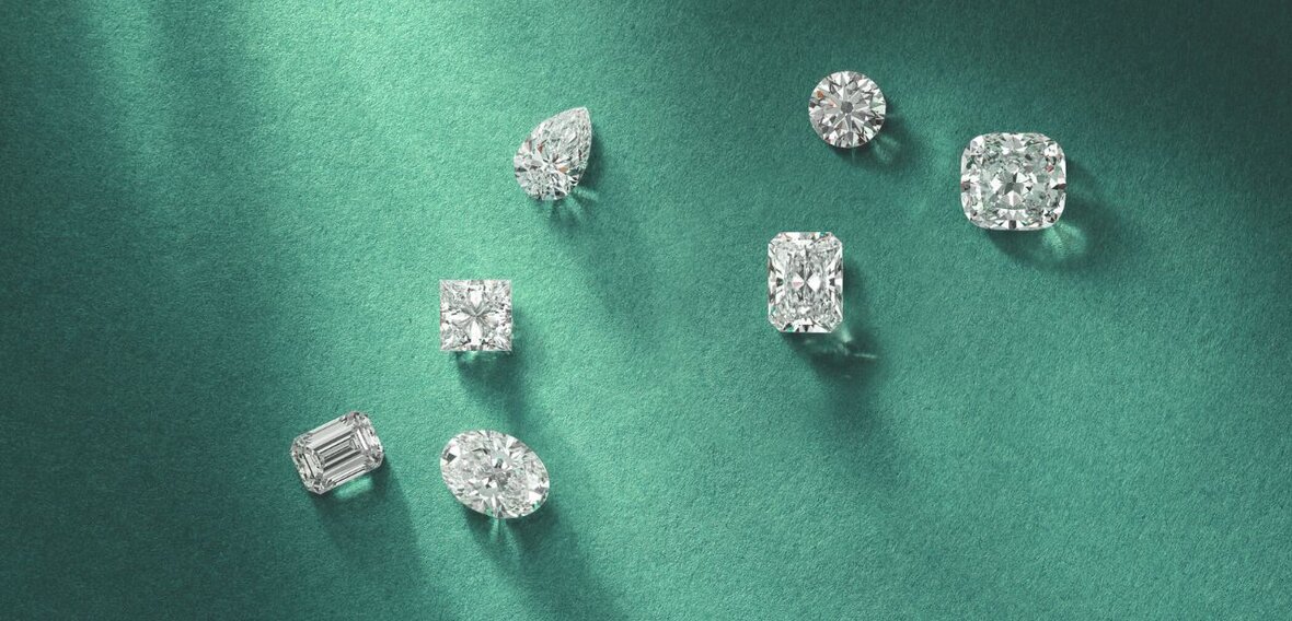 White and yellow gold diamond wedding bands styled on lace fabric, showcasing elegant bridal ring designs by Wedding Bands & Co. in Chicago