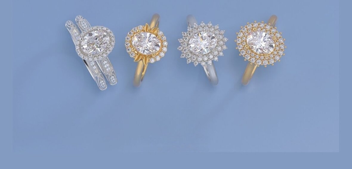 White and yellow gold engagement rings featuring elongated diamond shapes that look bigger