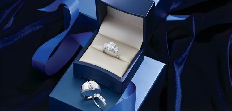 Multiple ring stack including engagement ring, wedding band, and anniversary ring showing bridal jewelry layering