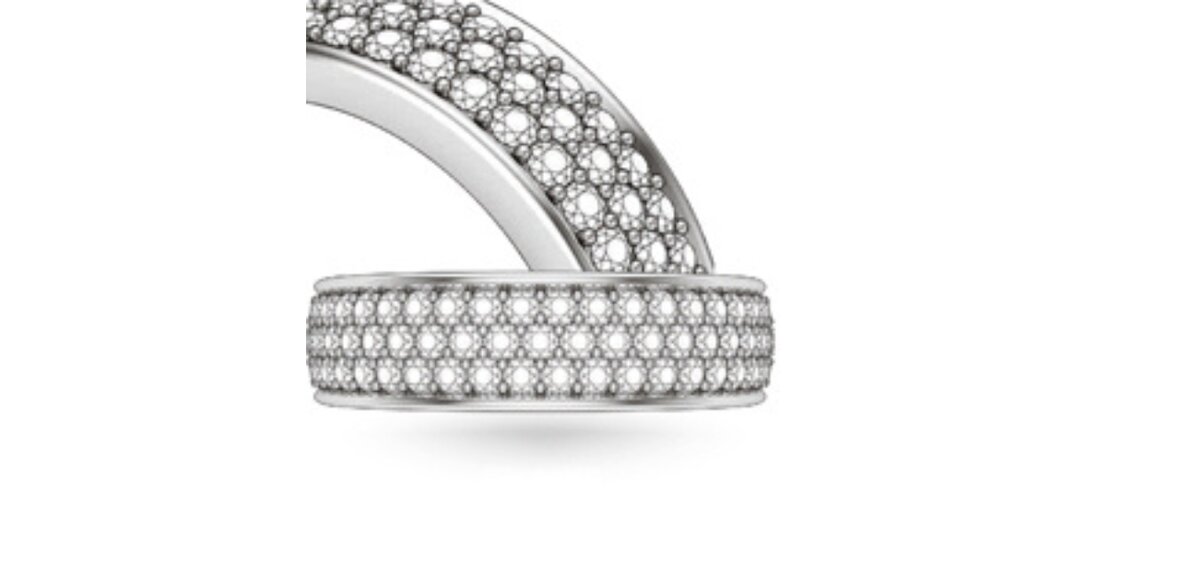 Engagement ring with pavé-set diamonds held by shared small prongs