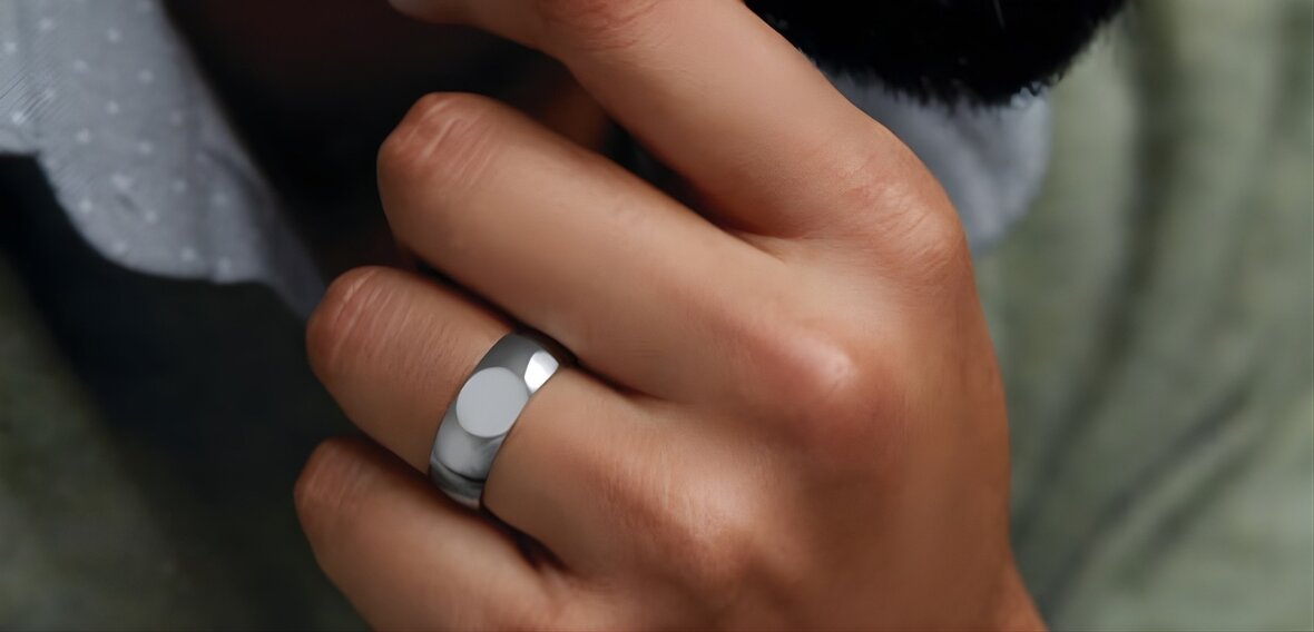 Modern wedding bands in yellow gold, white gold, and platinum showing price variations by material