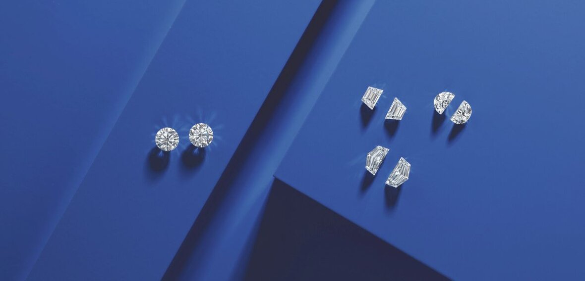 Elegant gold engagement ring with diamond pavé band stacked with matching wedding bands by Wedding Bands & Co., Chicago custom jeweler