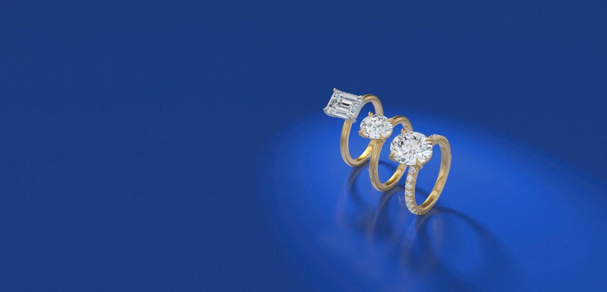 White and yellow gold diamond wedding bands styled on lace fabric, showcasing elegant bridal ring designs by Wedding Bands & Co. in Chicago