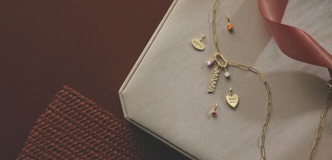 White and yellow gold diamond wedding bands styled on lace fabric, showcasing elegant bridal ring designs by Wedding Bands & Co. in Chicago