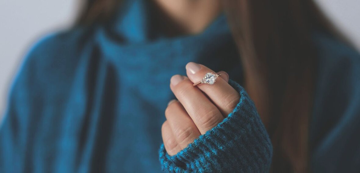 White and yellow gold diamond wedding bands styled on lace fabric, showcasing elegant bridal ring designs by Wedding Bands & Co. in Chicago
