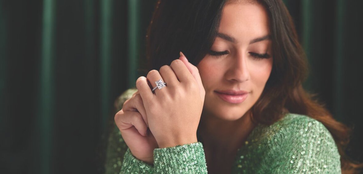 White and yellow gold diamond wedding bands styled on lace fabric, showcasing elegant bridal ring designs by Wedding Bands & Co. in Chicago