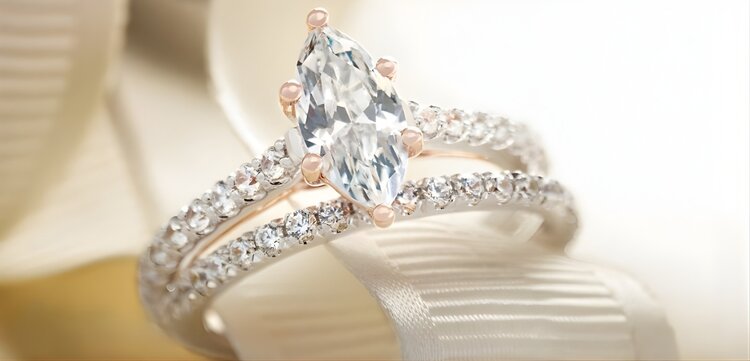 Close-up of hidden halo diamond engagement ring showcasing subtle sparkle from side angle