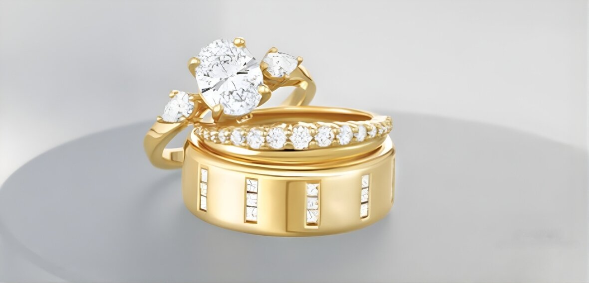 Multiple gold engagement and wedding ring sets in various karats showing stacking configurations