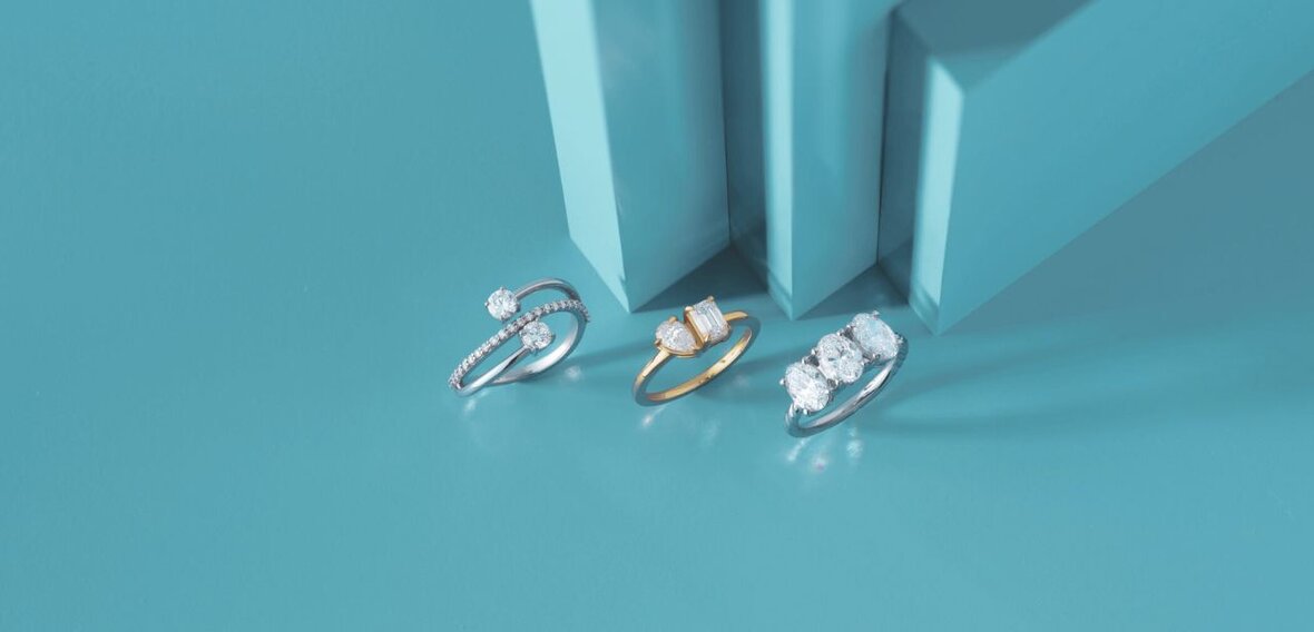 Elegant gold engagement ring with diamond pavé band stacked with matching wedding bands by Wedding Bands & Co., Chicago custom jeweler