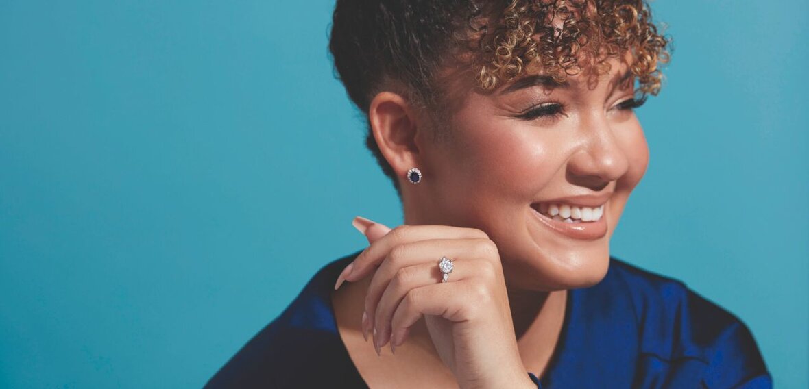 White and yellow gold diamond wedding bands styled on lace fabric, showcasing elegant bridal ring designs by Wedding Bands & Co. in Chicago