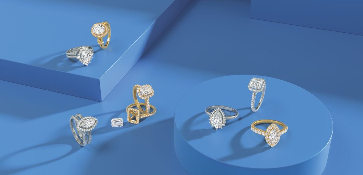 White and yellow gold diamond wedding bands styled on lace fabric, showcasing elegant bridal ring designs by Wedding Bands & Co. in Chicago