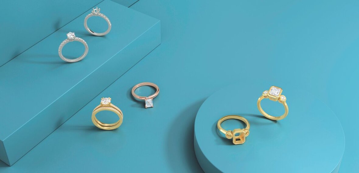 White and yellow gold diamond wedding bands styled on lace fabric, showcasing elegant bridal ring designs by Wedding Bands & Co. in Chicago