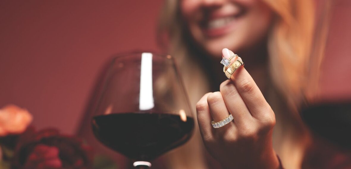 White and yellow gold diamond wedding bands styled on lace fabric, showcasing elegant bridal ring designs by Wedding Bands & Co. in Chicago