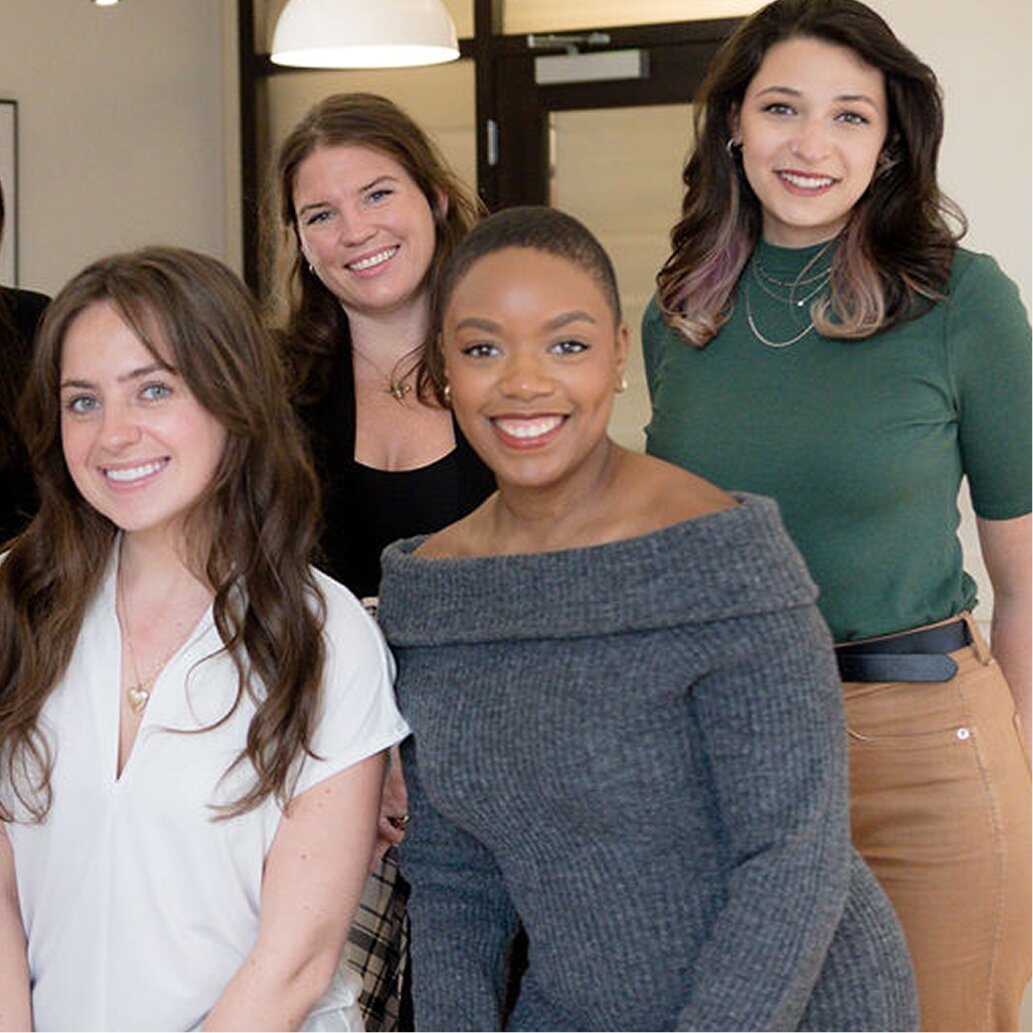 Person smiling holding shopping bag