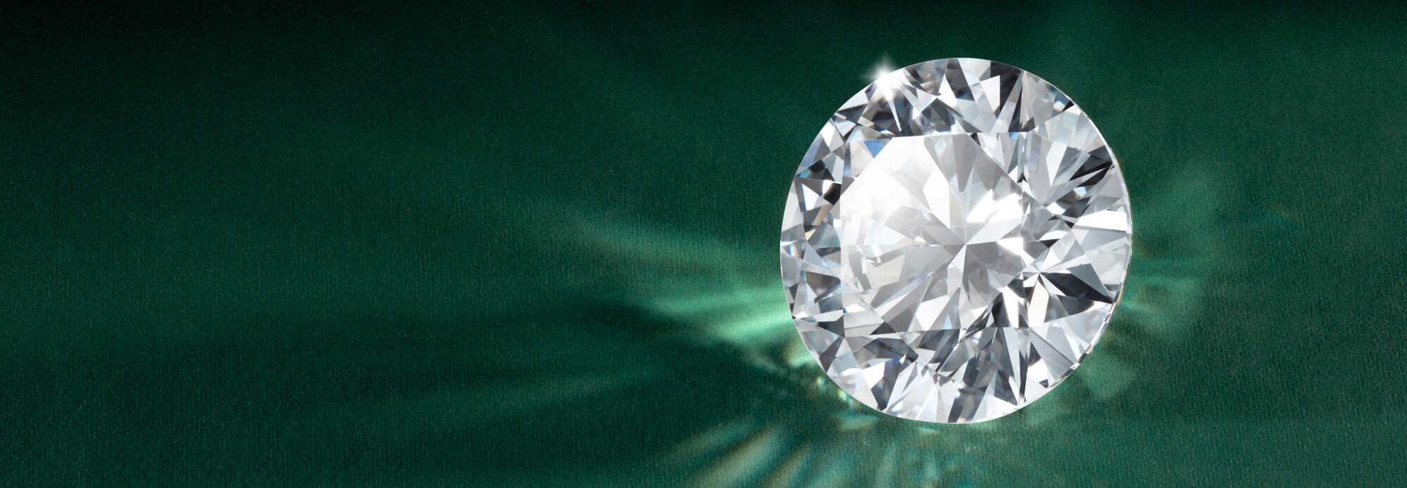 Close-up of someone's hand wearing a diamond engagement ring, emphasizing transparency and brilliance