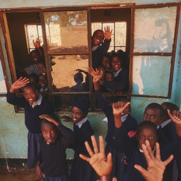 Group with raised hands at community gathering
