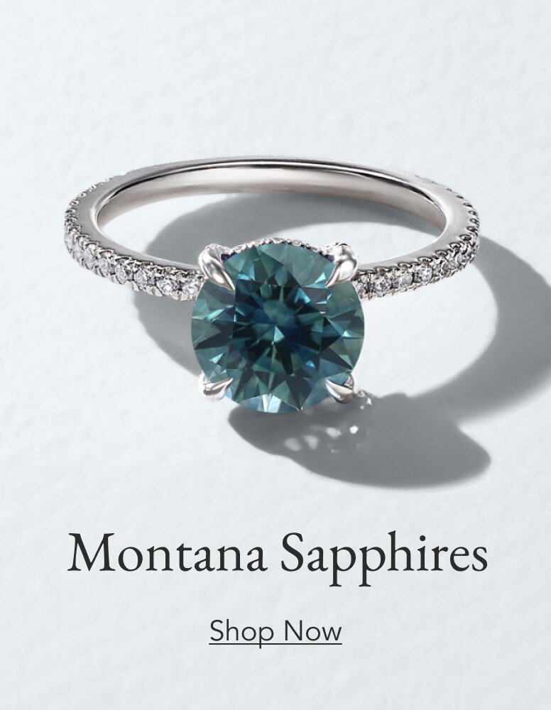 Diamond accented engagement ring set with a Montana sapphire.
