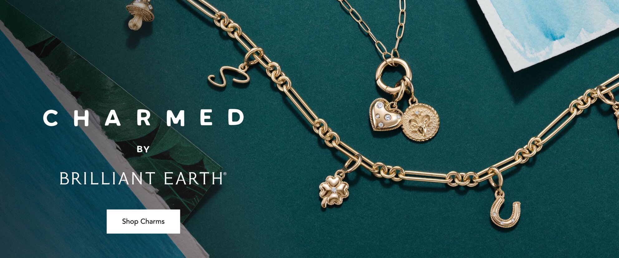 Gold charm bracelet and charm necklace.