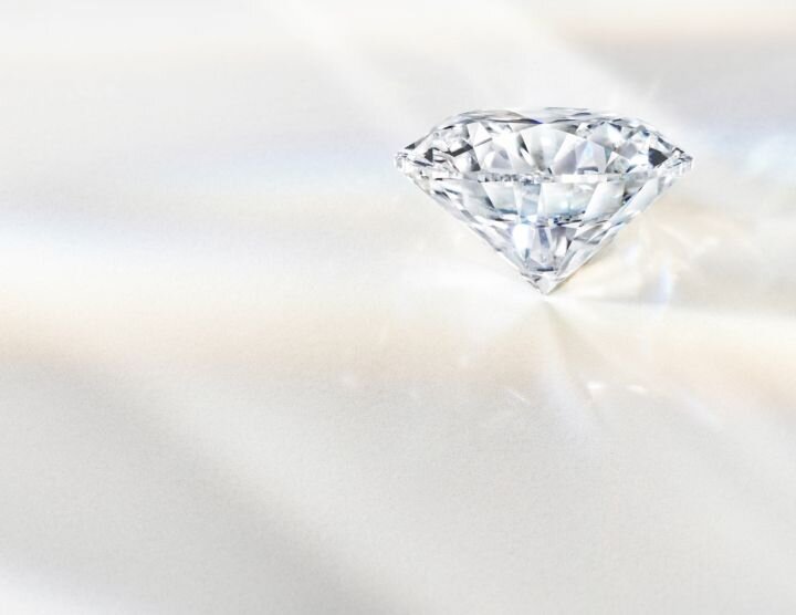 Artistic rendering of a brilliant-cut diamond with light reflections