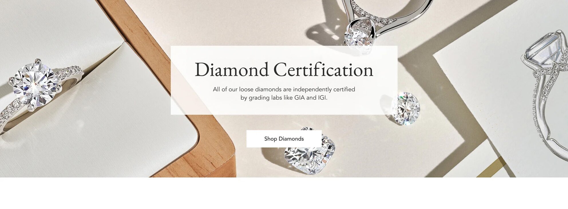 Assortment of loose diamonds and diamond engagement rings