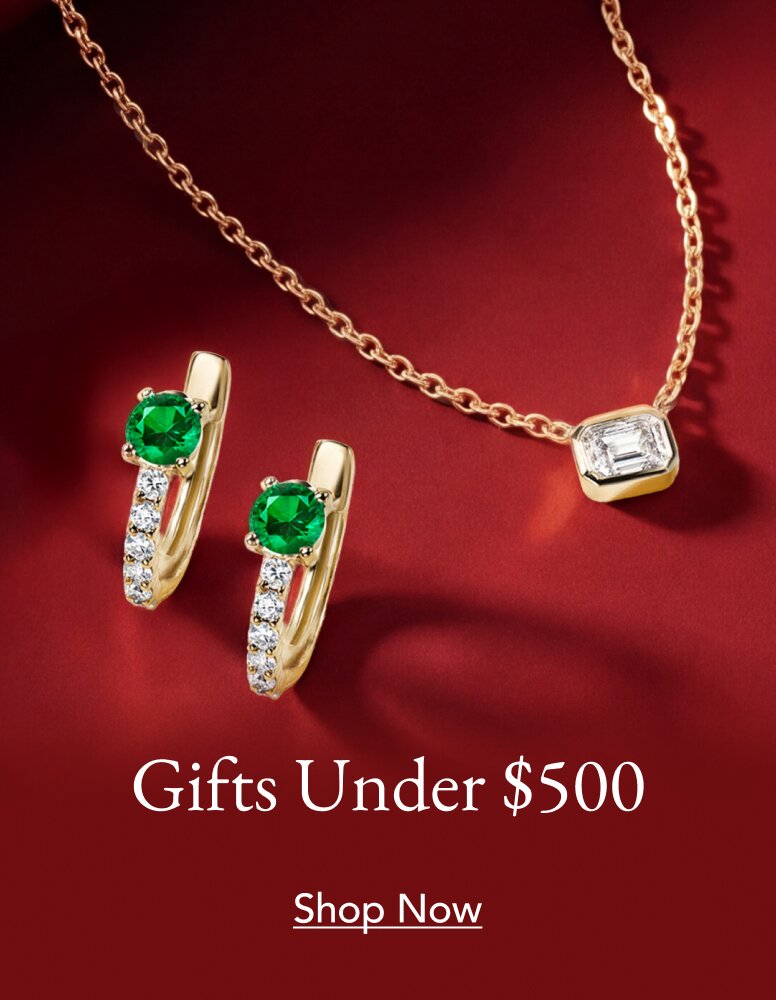 Emerald and diamond hoop earrings and a diamond bezel pendant.