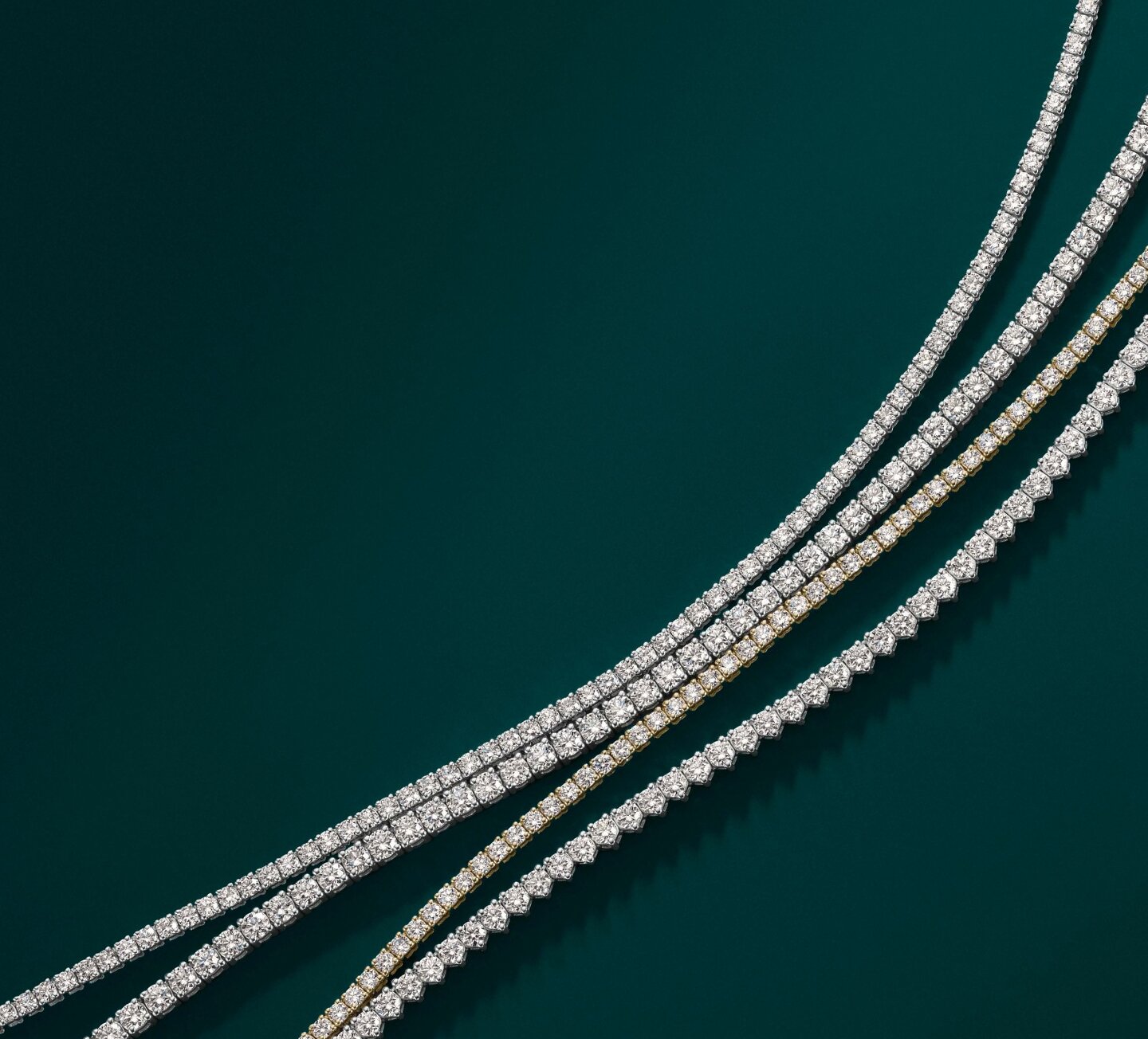 Geometric illustration of a diamond symbol in white against dark background